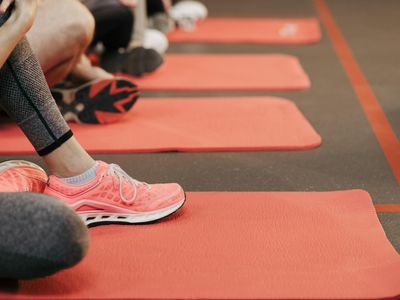 Detail of sneakers on a gym mat during exercise