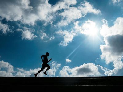 Silhouette of a person doing a dynamic cardio movement